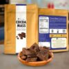 vegan cocoa mass from bolmay cocoa packaging with a plate of raw cocoa mass blocks in front of package